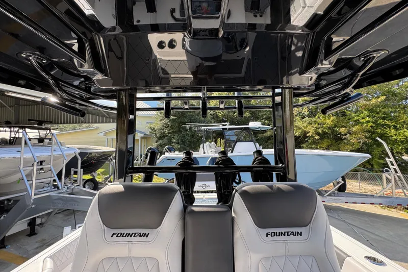  Yacht Photos Pics 2025 Fountain 32 NX boat interior with sleek design and comfortable seating.