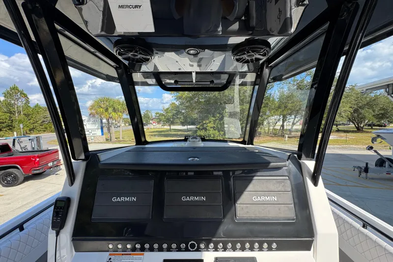  Yacht Photos Pics 2025 Fountain 32 NX boat dashboard with Garmin displays and Mercury controls.