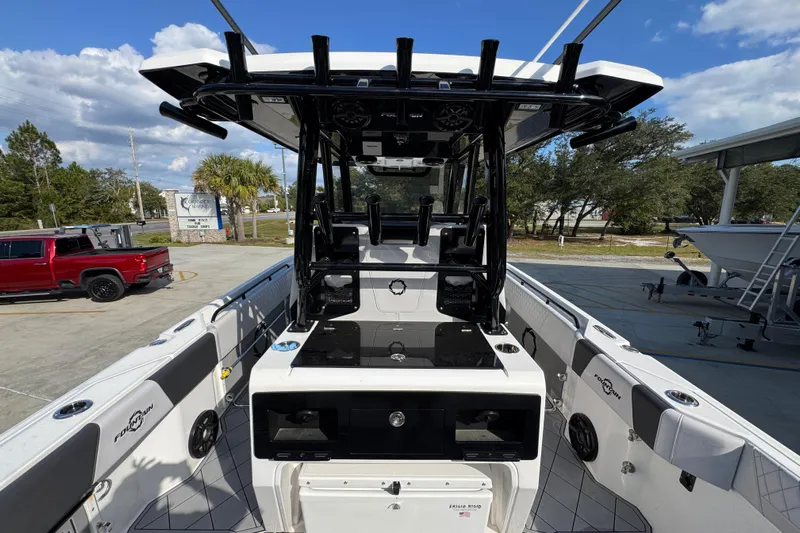  Yacht Photos Pics 2025 Fountain 32 NX boat interior with modern design and equipment, parked outdoors.