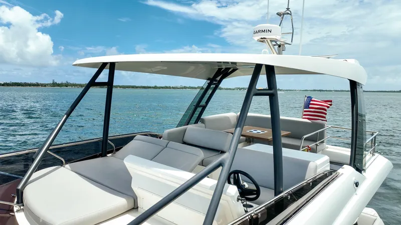 Soiral Yacht Photos Pics Luxury 2023 Prestige 520 yacht with sleek design, cruising on a sunny day.