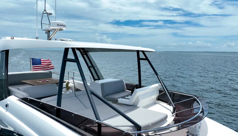 Soiral Yacht Photos Pics 2023 Prestige 520 yacht on open water, featuring sleek design and American flag.