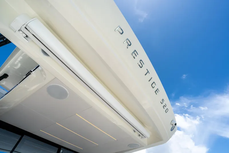 Soiral Yacht Photos Pics Luxury yacht Prestige 520, 2023 model, against a clear blue sky.