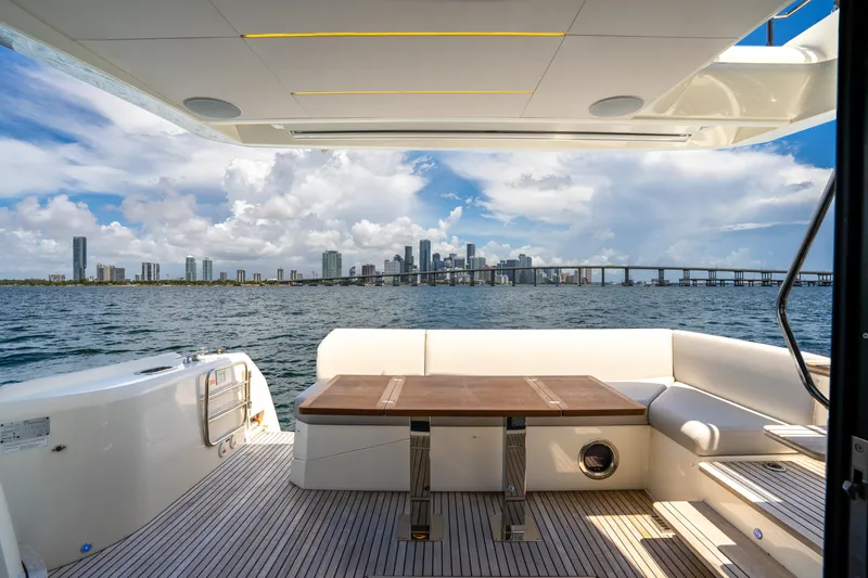 Soiral Yacht Photos Pics Luxury yacht deck view with city skyline, Prestige 520, 2023 model.