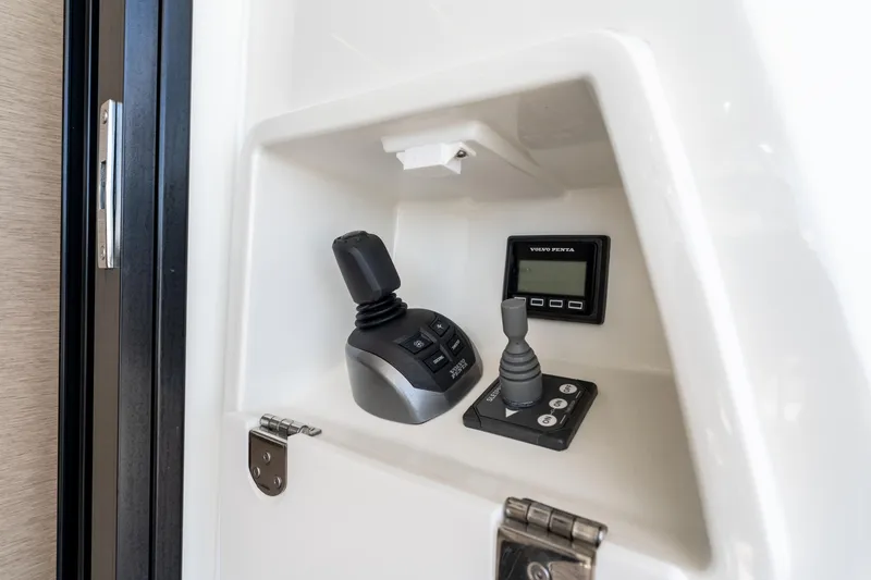 Soiral Yacht Photos Pics Control panel of 2023 Prestige 520 yacht featuring Volvo Penta joystick and display.