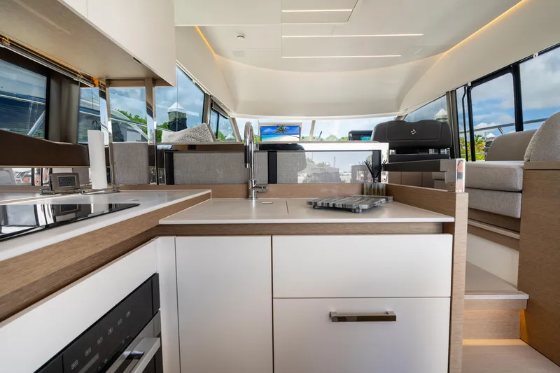 Soiral Yacht Photos Pics Modern kitchen interior of 2023 Prestige 520 yacht, featuring sleek design and ample natural light.
