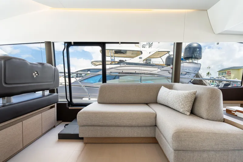 Soiral Yacht Photos Pics Luxurious interior of 2023 Prestige 520 yacht with modern seating and large windows.