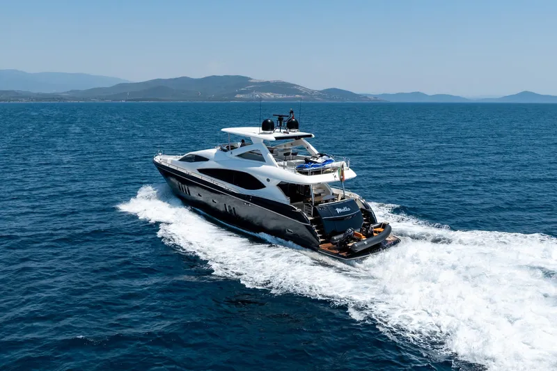 Mello Yacht Photos Pics 2008 Sunseeker 86 Yacht cruising on open sea with scenic mountain backdrop.