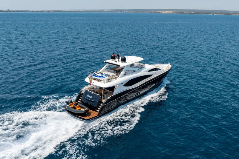 Mello Yacht Photos Pics Luxurious 2008 Sunseeker 86 Yacht cruising on open blue sea.