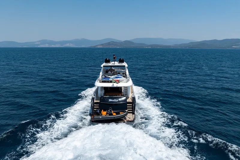 Mello Yacht Photos Pics Sunseeker 86 Yacht 2008 cruising on open sea with mountainous backdrop.
