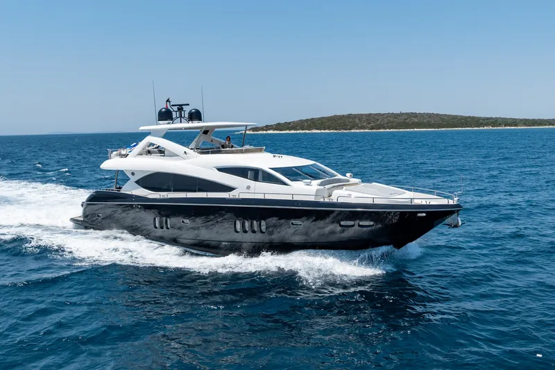 Mello Yacht Photos Pics 2008 Sunseeker 86 Yacht cruising on open sea under clear blue sky.