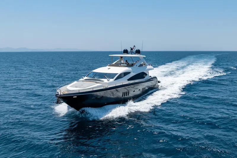 Mello Yacht Photos Pics 2008 Sunseeker 86 Yacht cruising on open sea under clear blue sky.