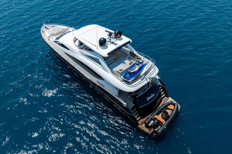 Mello Yacht Photos Pics Luxurious 2008 Sunseeker 86 Yacht cruising on clear blue ocean waters.