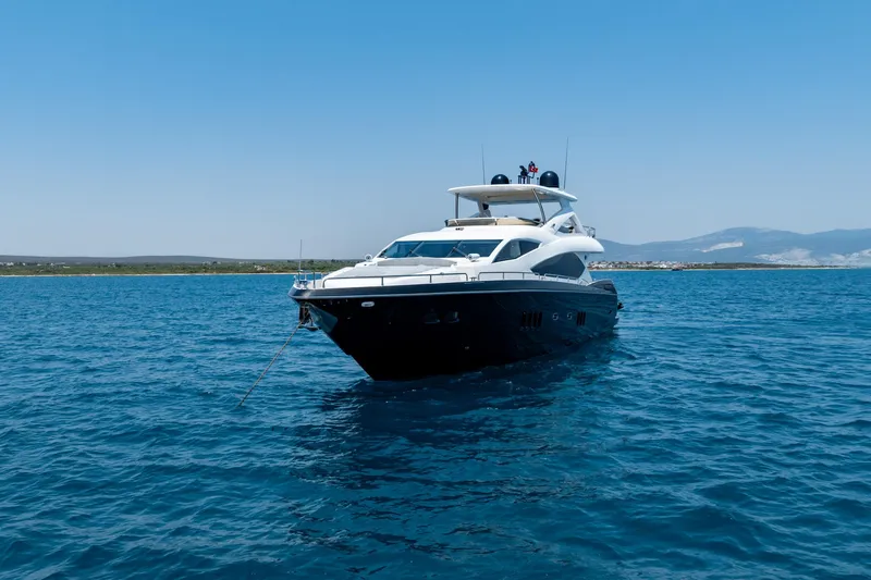 Mello Yacht Photos Pics 2008 Sunseeker 86 Yacht on open water, clear sky, distant shoreline.