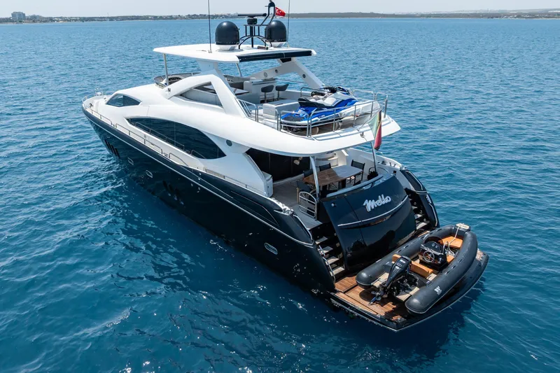 Mello Yacht Photos Pics Luxurious 2008 Sunseeker 86 Yacht cruising on clear blue waters.