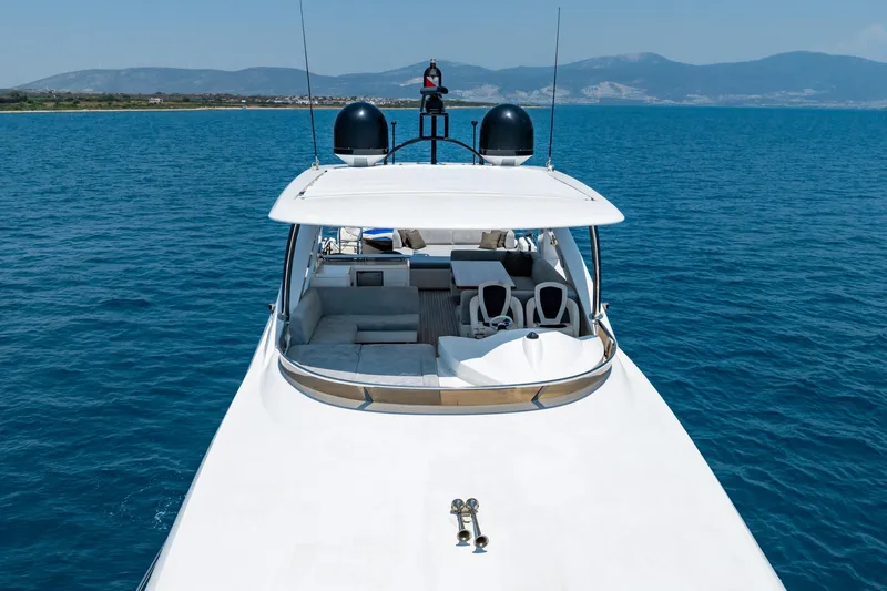 Mello Yacht Photos Pics 2008 Sunseeker 86 Yacht cruising on blue ocean with scenic mountain backdrop.