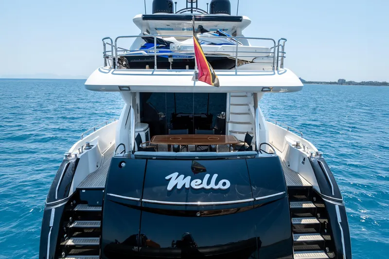 Mello Yacht Photos Pics Sunseeker 86 Yacht 2008 on open sea, rear view with flag and deck.