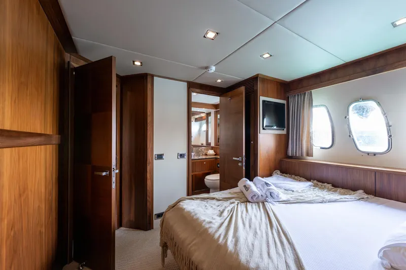 Mello Yacht Photos Pics Luxurious cabin interior of 2008 Sunseeker 86 Yacht with elegant wood finishes.