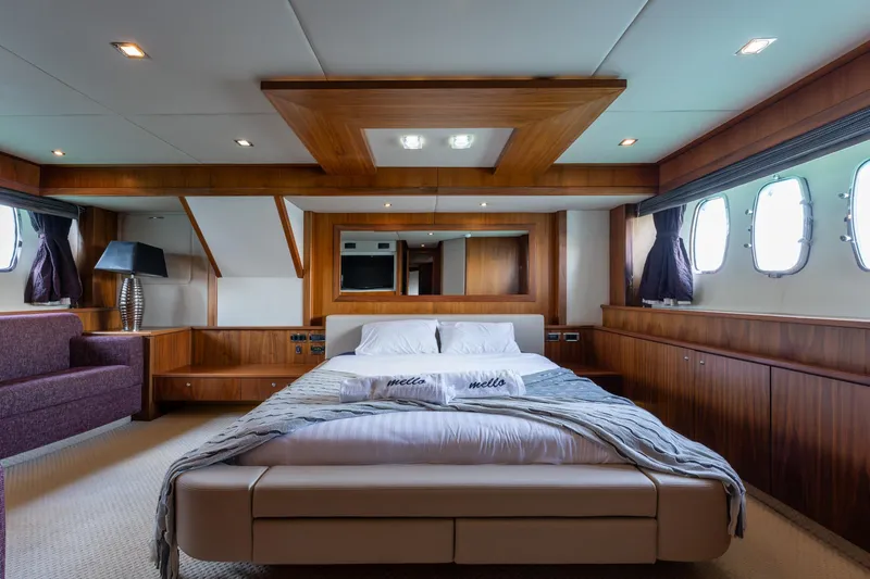 Mello Yacht Photos Pics Luxurious 2008 Sunseeker 86 Yacht bedroom with elegant wood paneling and modern decor.