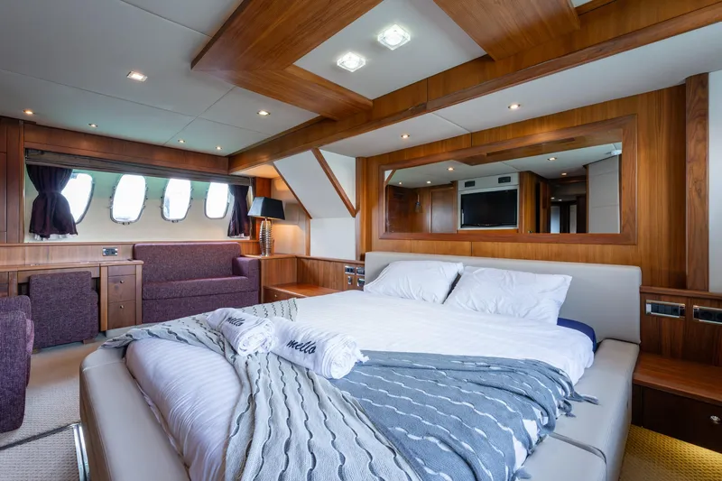 Mello Yacht Photos Pics Luxurious 2008 Sunseeker 86 Yacht bedroom with elegant wood paneling and modern decor.