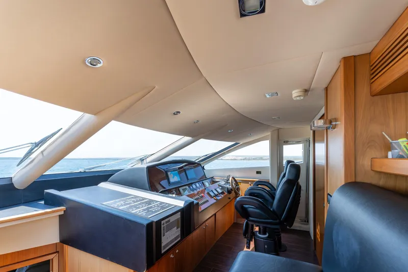 Mello Yacht Photos Pics Interior view of 2008 Sunseeker 86 Yacht cockpit with modern controls and seating.