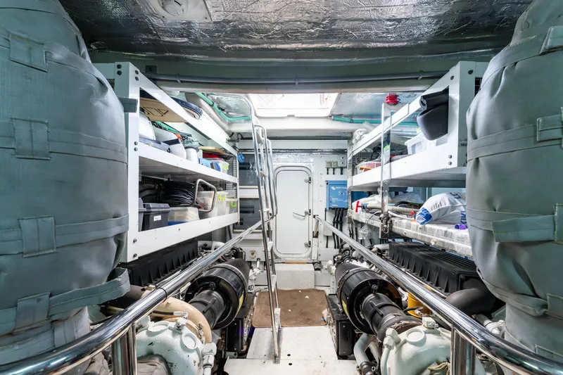 Mello Yacht Photos Pics Engine room of a 2008 Sunseeker 86 Yacht, featuring organized storage and equipment.