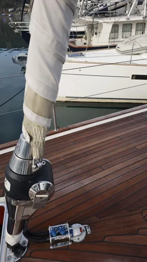 Hallberg Rassy 57 2020 Yacht Photos Pics 2020 Hallberg-Rassy 57 yacht deck with polished wood and rigging details.