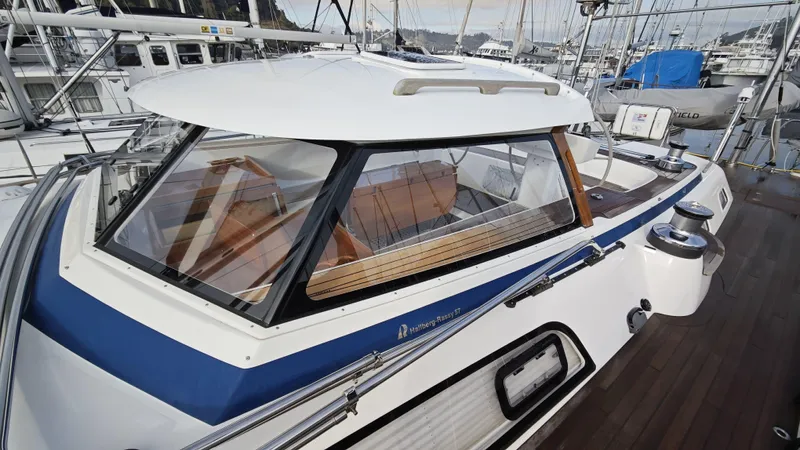 Hallberg Rassy 57 2020 Yacht Photos Pics 2020 Hallberg-Rassy 57 yacht with sleek design and spacious cockpit at marina.