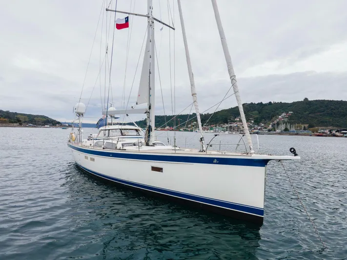 Hallberg Rassy 57 2020 Yacht Photos Pics 2020 Hallberg-Rassy 57 yacht anchored in scenic coastal waters.