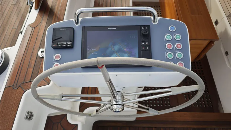 Hallberg Rassy 57 2020 Yacht Photos Pics Steering wheel and navigation system on 2020 Hallberg-Rassy 57 yacht.