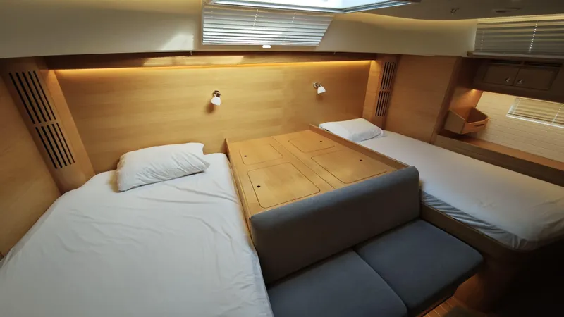 Hallberg Rassy 57 2020 Yacht Photos Pics Luxurious 2020 Hallberg-Rassy 57 yacht cabin with twin beds and modern wood finish.