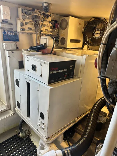 A2z's Yacht Photos Pics Engine room of 1999 Viking 55 Convertible with Onan Marine GenSet.