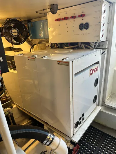 A2z's Yacht Photos Pics Engine room of 1999 Viking 55 Convertible with Onan generator and control panel.