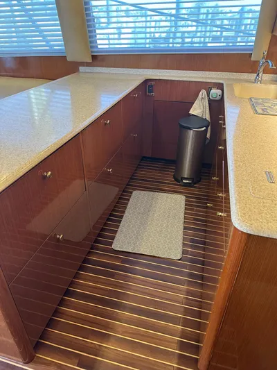A2z's Yacht Photos Pics 1999 Viking 55 Convertible yacht kitchen with wood flooring and modern countertops.