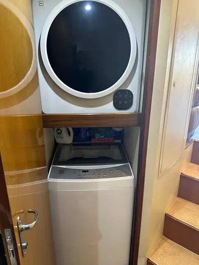 A2z's Yacht Photos Pics Stacked washer and dryer in 1999 Viking 55 Convertible yacht interior.