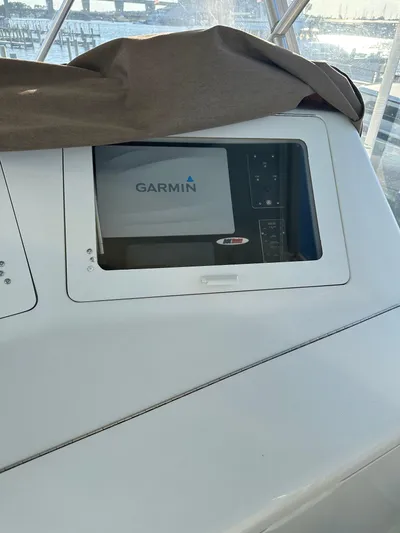 A2z's Yacht Photos Pics Garmin navigation system on 1999 Viking 55 Convertible yacht dashboard.
