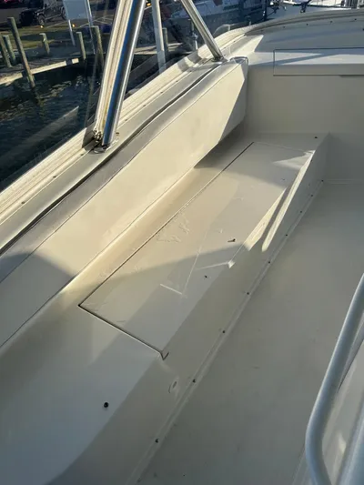 A2z's Yacht Photos Pics 1999 Viking 55 Convertible boat deck with seating and railing.