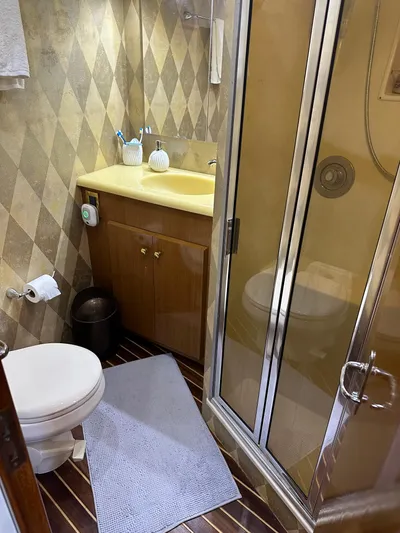 A2z's Yacht Photos Pics Bathroom in 1999 Viking 55 Convertible yacht with shower, sink, and toilet.