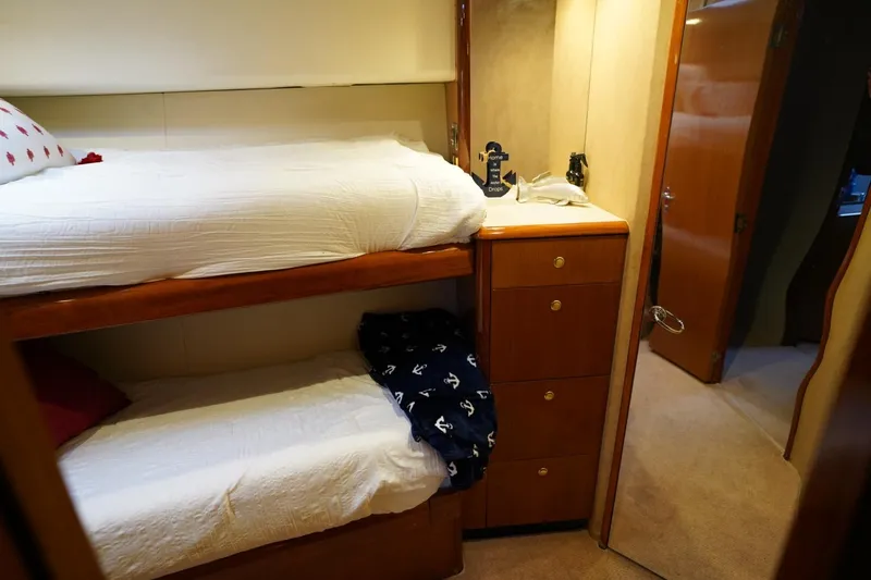 A2z's Yacht Photos Pics Bunk beds in 1999 Viking 55 Convertible yacht cabin with wooden cabinetry.