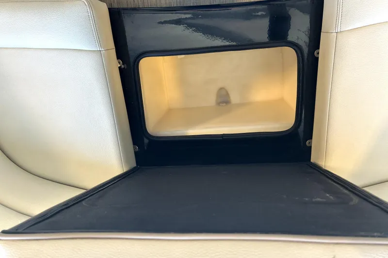 Yacht Photos Pics 2019 Regal 2800 Bowrider storage compartment with beige interior and black trim.