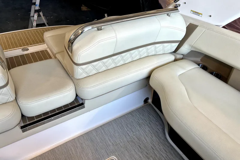 Yacht Photos Pics Luxurious seating on 2019 Regal 2800 Bowrider boat with beige upholstery and stainless steel accents.