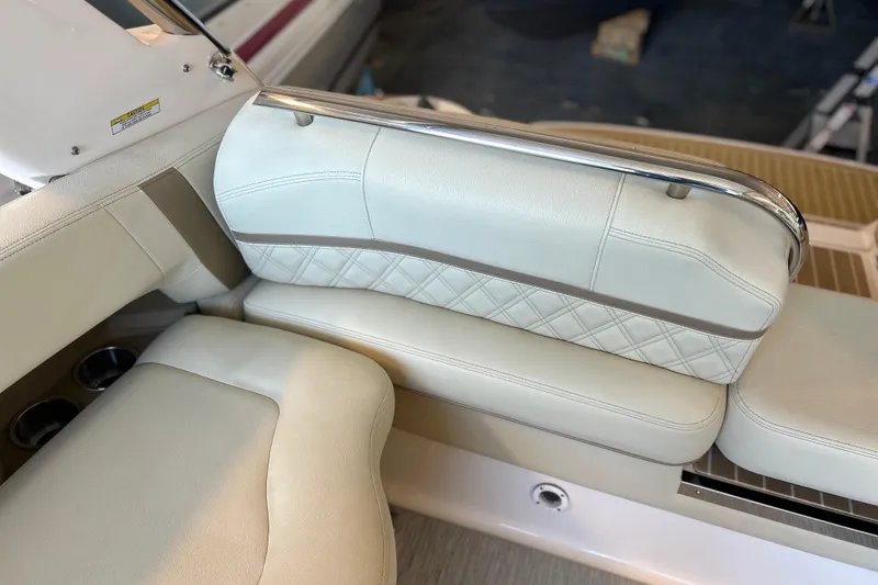  Yacht Photos Pics 2019 Regal 2800 Bowrider interior seating with elegant white upholstery and stainless steel accents.