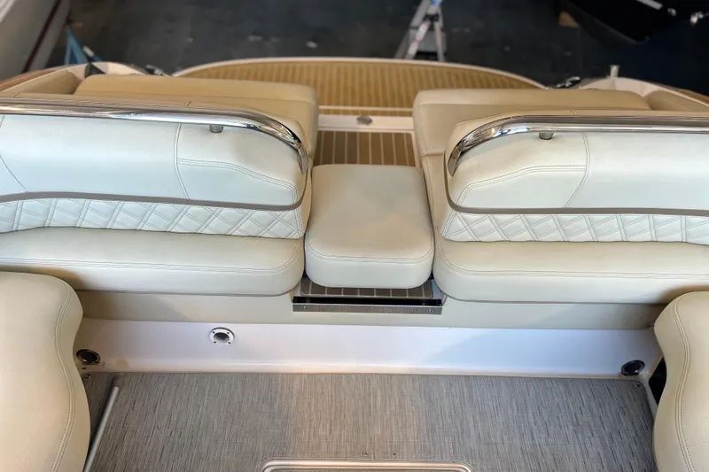  Yacht Photos Pics 2019 Regal 2800 Bowrider boat interior with beige leather seating and stainless steel accents.