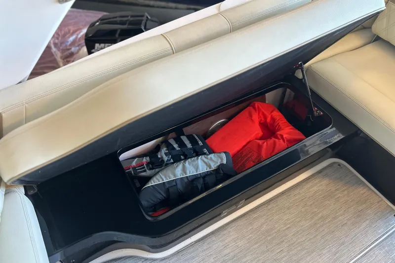  Yacht Photos Pics 2019 Regal 2800 Bowrider storage compartment with life jackets and safety gear.