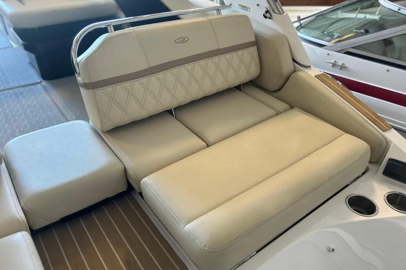  Yacht Photos Pics Luxurious seating on 2019 Regal 2800 Bowrider boat, featuring beige upholstery and cup holders.