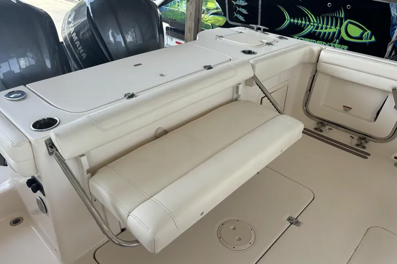 325-708 Brokerage Josh Yacht Photos Pics 2021 Grady-White Freedom 325 boat interior with foldable seating and Yamaha engines.