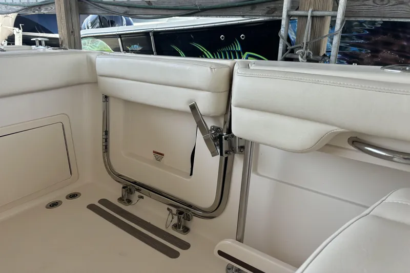 325-708 Brokerage Josh Yacht Photos Pics 2021 Grady-White Freedom 325 boat interior with white seating and stainless steel fixtures.