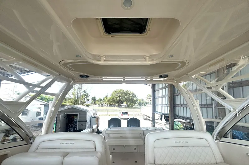 325-708 Brokerage Josh Yacht Photos Pics 2021 Grady-White Freedom 325 boat interior with spacious seating and open roof design.
