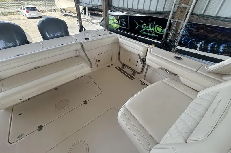 325-708 Brokerage Josh Yacht Photos Pics 2021 Grady-White Freedom 325 boat interior with spacious seating and dual engines.