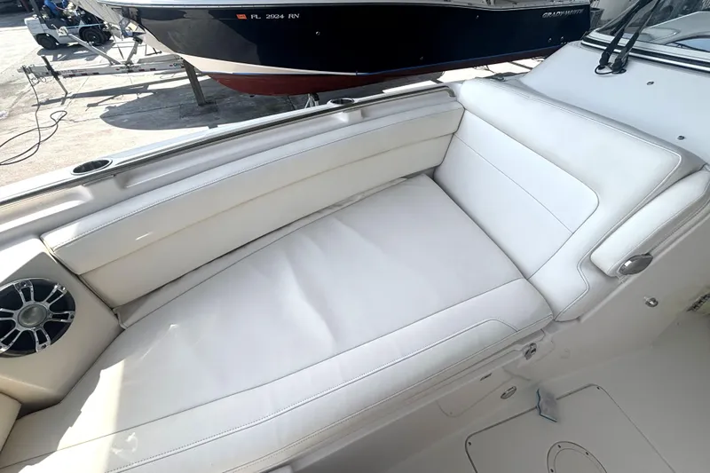 325-708 Brokerage Josh Yacht Photos Pics 2021 Grady-White Freedom 325 boat interior with white cushioned seating.