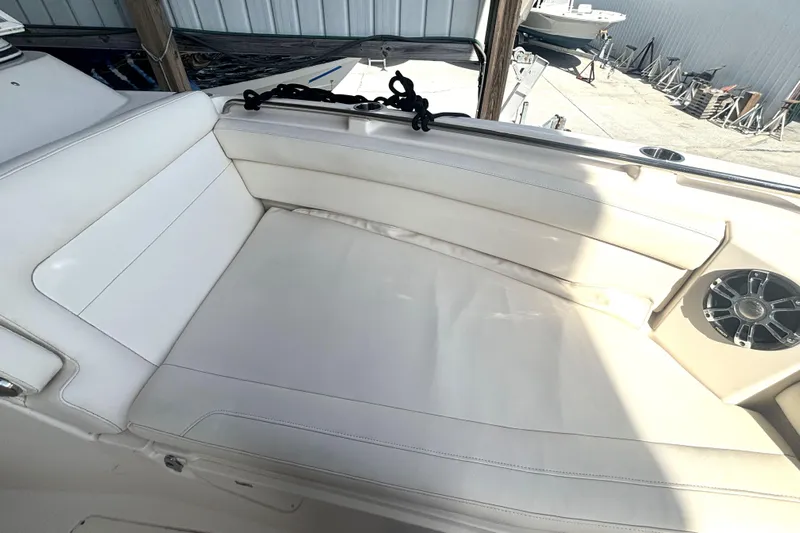 325-708 Brokerage Josh Yacht Photos Pics 2021 Grady-White Freedom 325 boat interior with white seating and speaker.